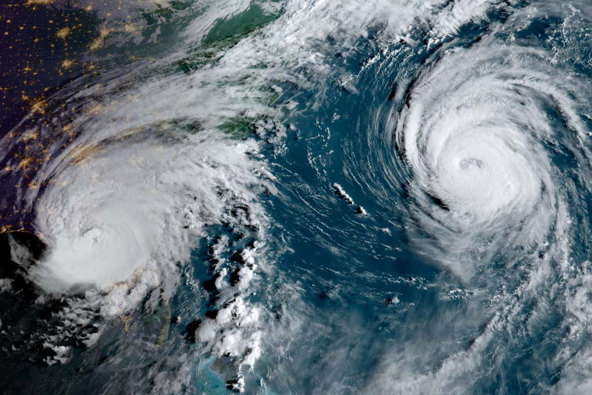 2RMX7JT Hurricane Idalia (left) as it is making landfall on Wednesday morning, August 30, 2023, near Keaton Beach, Florida, while Hurricane Franklin (left) churns in the Atlantic. (USA)